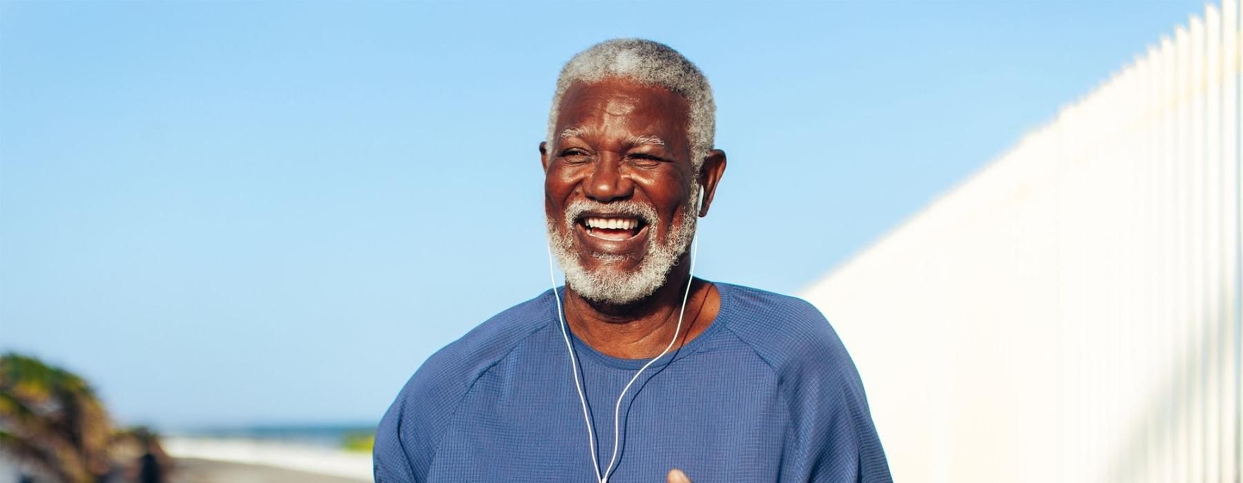 a man holding a water bottle while outdoors